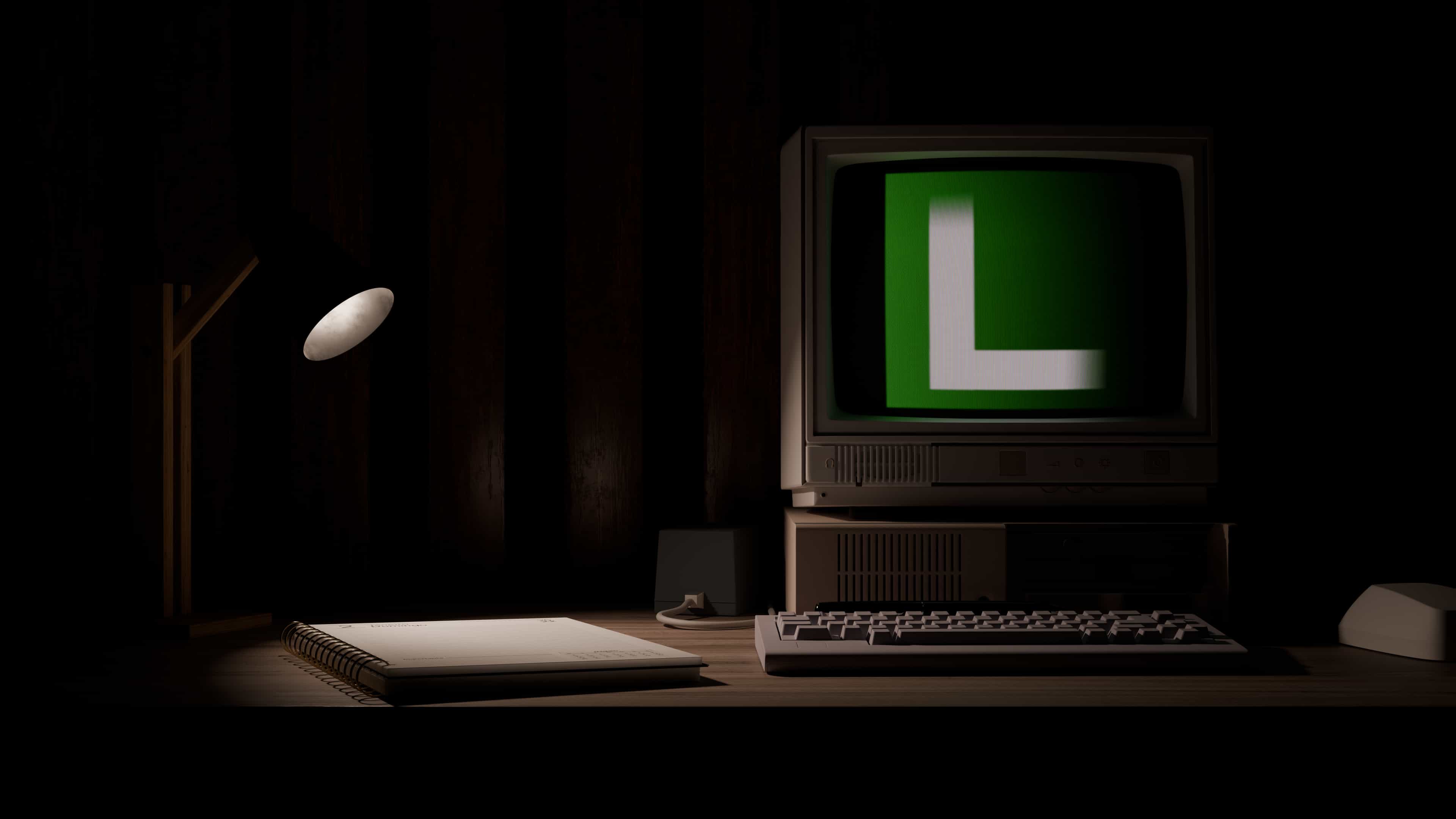 Computer on a desk showing the website logo: a white L in a green square on a black background.